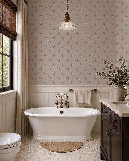 Foraged Bloom Warm Brown wallpaper in an elegant bathroom with a freestanding tub, dark vanity and white paneling.