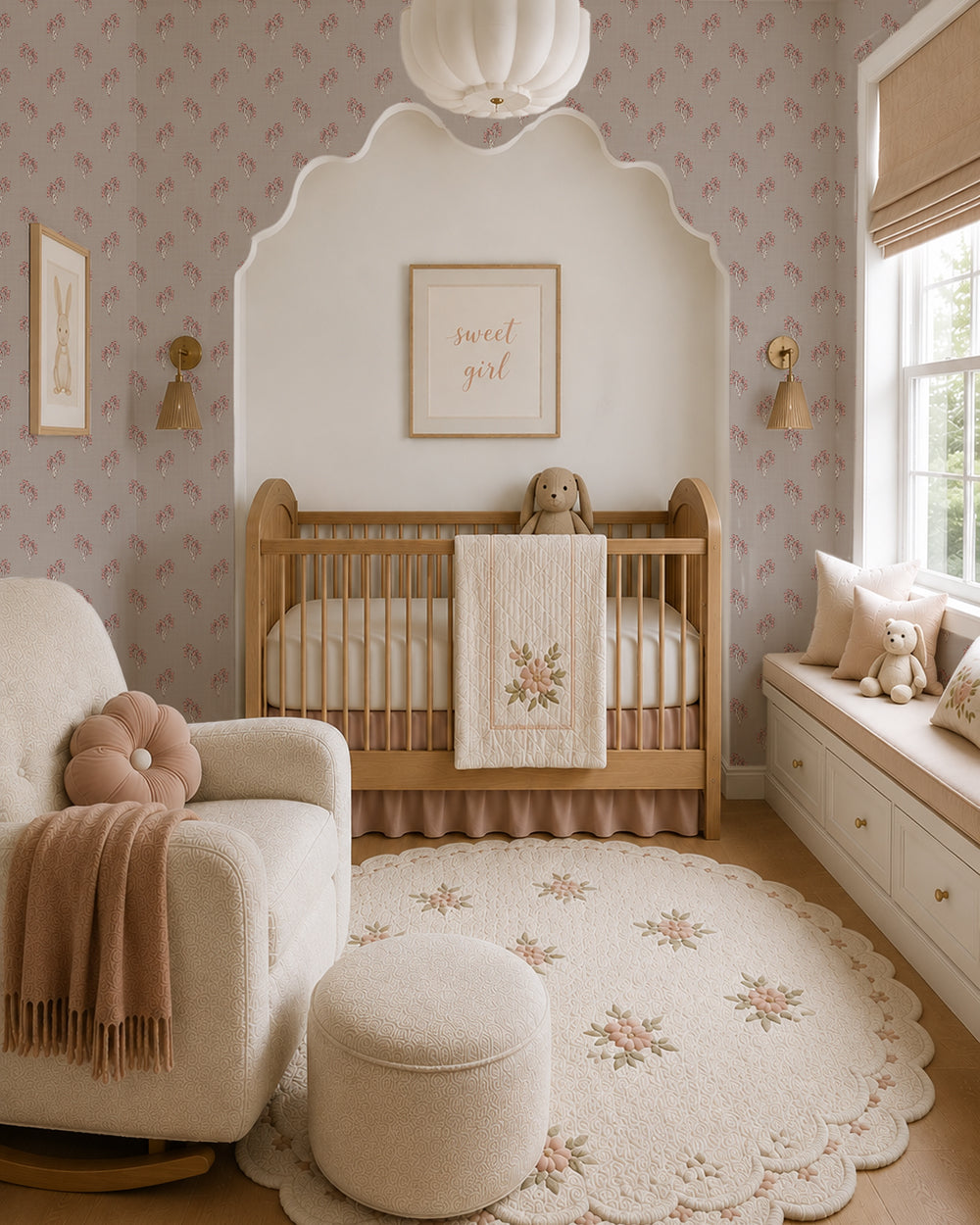 Foraged Bloom Warm Brown wallpaper in a cozy nursery with a wood crib, cream chair and soft blush accents.