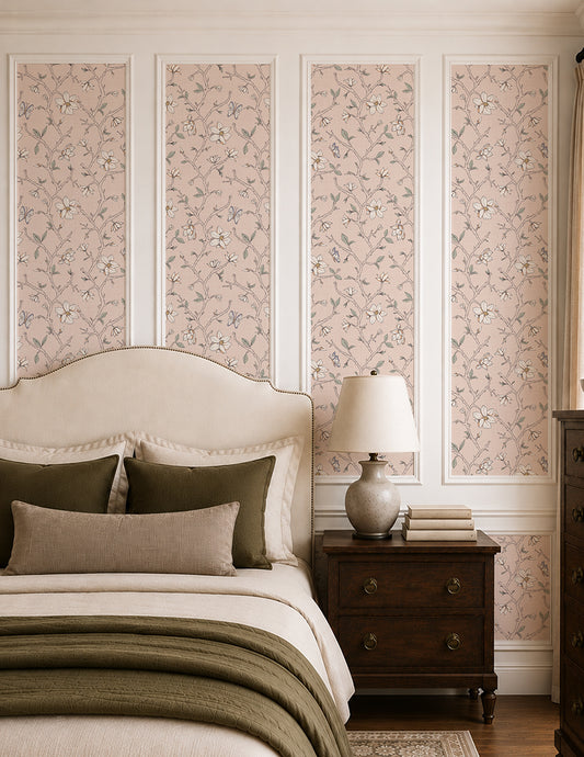 Magnolia Bloom Blush wallpaper in an elegant bedroom with cream bedding, dark wood furniture and soft green accents.