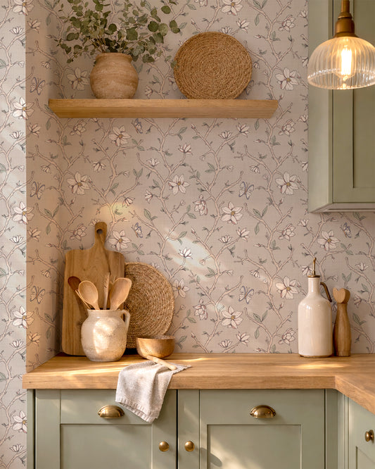 Magnolia Bloom Taupe wallpaper in a warm kitchen with wood counters, cream cabinetry and natural decor.